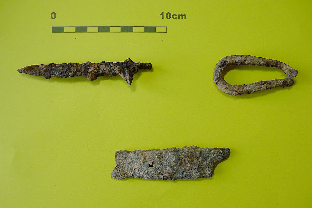 Three samples of metalwork - a knife blade, a chain link, part of a hinge strap - excavated from the lost Somerset hamlet of Tappingweir near the River Parrett.