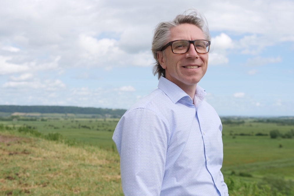 Somerset Rivers Authority Manager David Mitchell on Burrow Mump with Somerset Levels and Moors stretching out into the distance below.